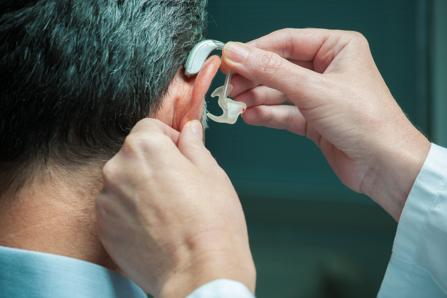 Hearing aid being checked during a repair visit in Chambersburg